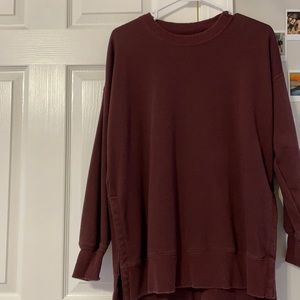 A Burgundy Aerie sweater in a size XS